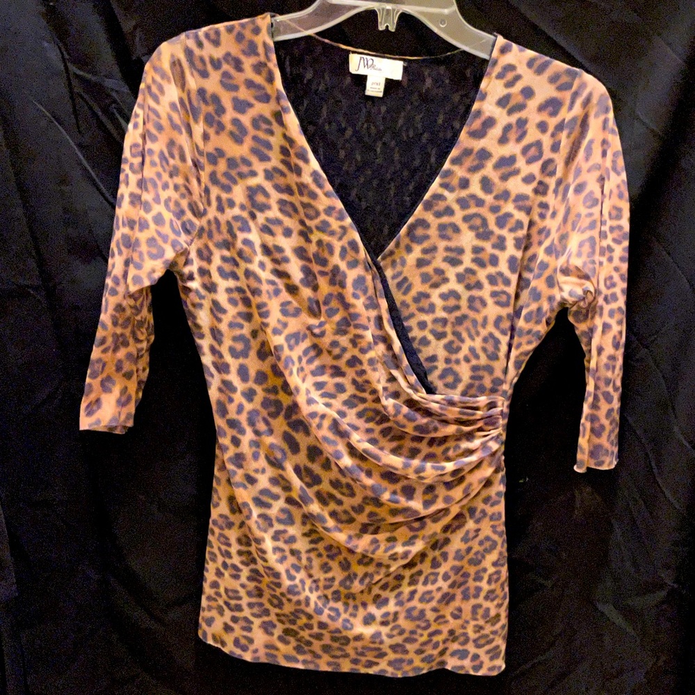 Animal print, 3/4” sleeves, V-Neck, lined, stretchy fabric, top